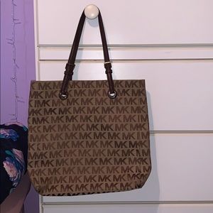 Michael Kors tote bag and matching wristlet.